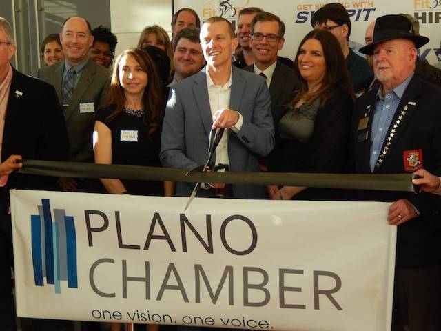 Jon Kendall and Osky Blue team cutting ribbon with Plano Chamber of Commerce