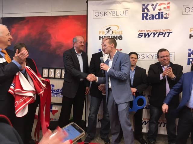 Rich Allen and Jon Kendall shaking hands at Osky Blue ribbon cutting