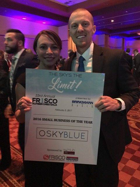 Anna Hawkins and Jon Kendall hold Osky Blue's 2016 Small Business of the Year Award
