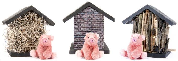 Three little pigs in front of their houses of straw, sticks and bricks
