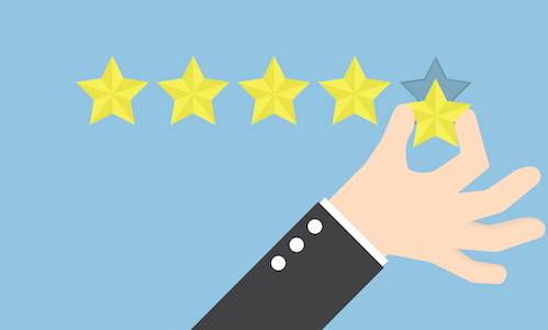 Businessman's hand giving five star rating
